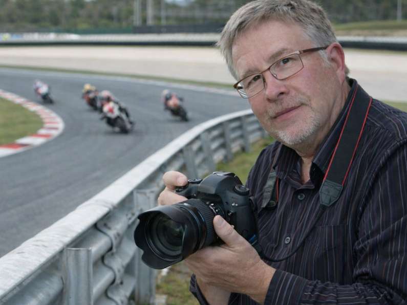 Terry Jos;in Motorcycle Photgraper camera in hand on the side of a Motor Bike race Track Terry Jos;in Motorcycle Photgraper camera in hand on the side of a Motor Bike race Track